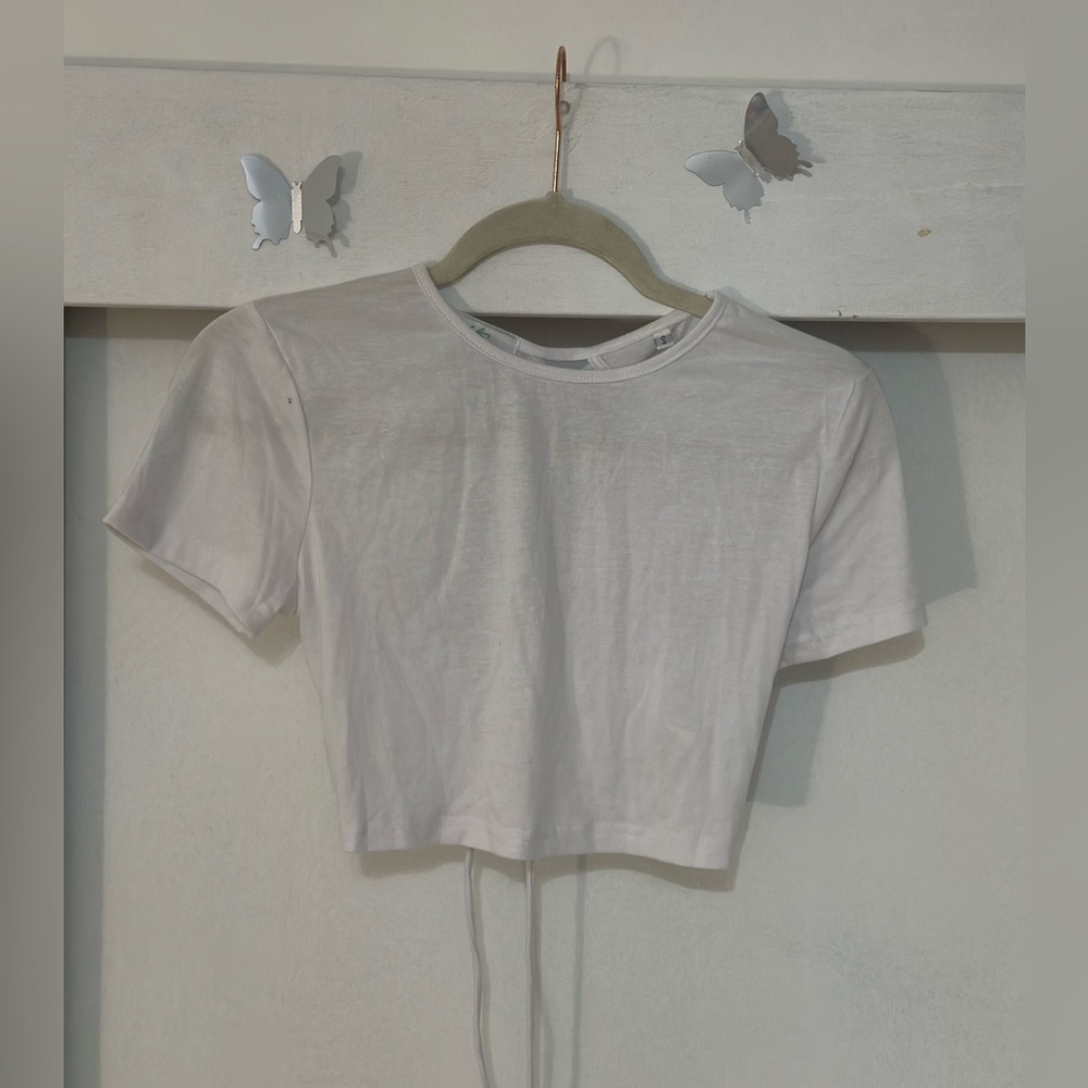White top with cross cross details
